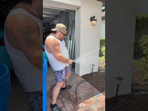 Broadway Pixels watering plants outside